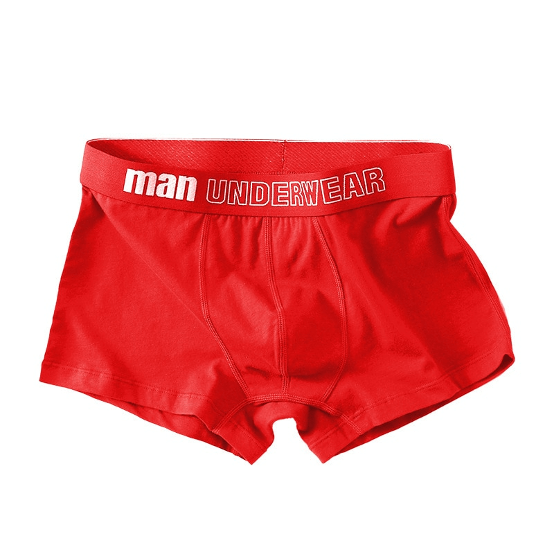 Red solid color cotton male boxers, underwear for men, showcasing comfort and style with a breathable fabric waistband detail.